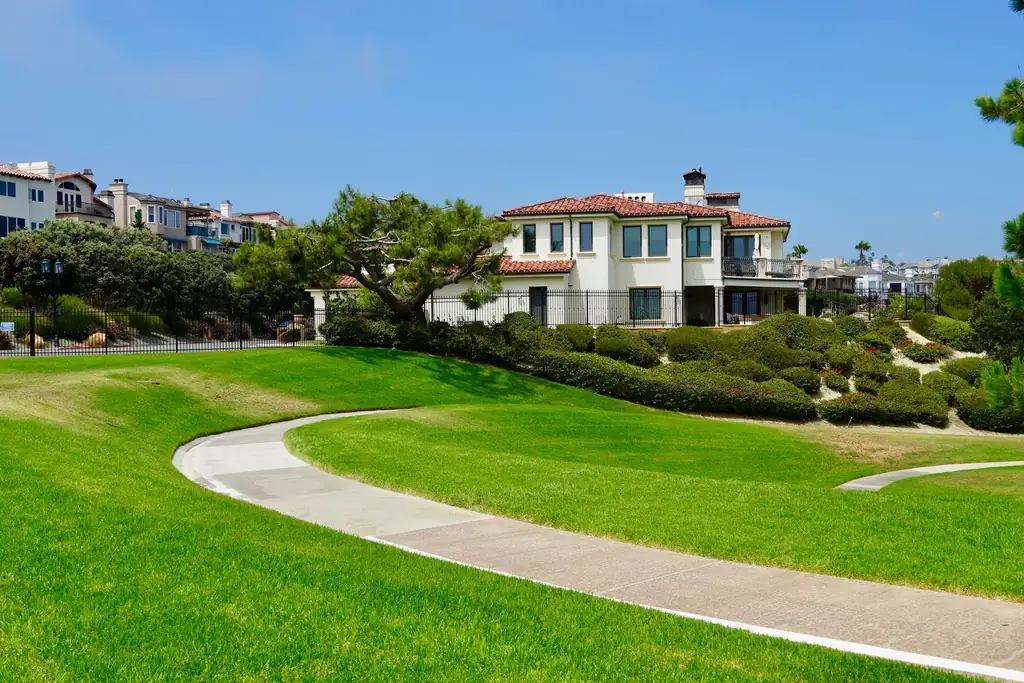 Manicured lawn and curving walkway at a landscaped property